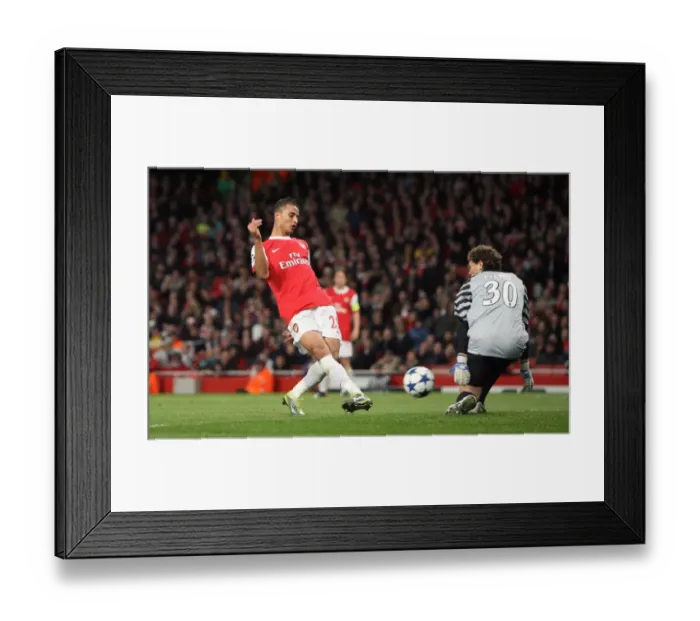 Framed Print : Marouane Chamakh scores Arsenals 5th goal past Andriy Pyatov (Shaktar) Framed Print : Marouane Chamakh scores Arsenals 5th goal past Andriy Pyatov (Shaktar)