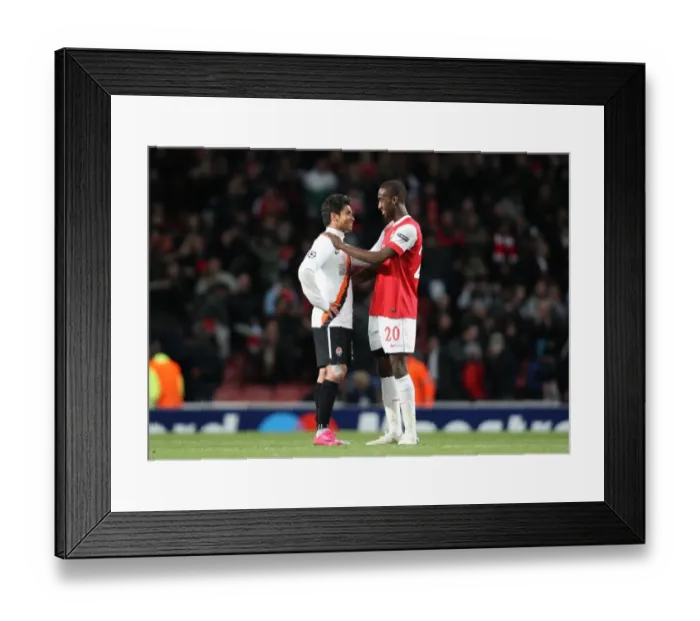 Framed Print : Johan Djourou (Arsenal) chats with Eduardo (Shaktar) the former Arsenal player after the match