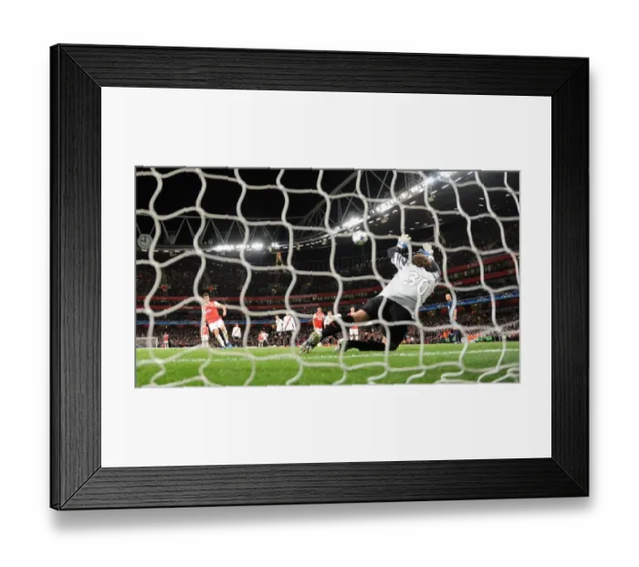 Framed Print : Cesc Fabregas shoots past Shakhtar goalkeeper Andriy Pyatov score the 3rd Arsenal goal