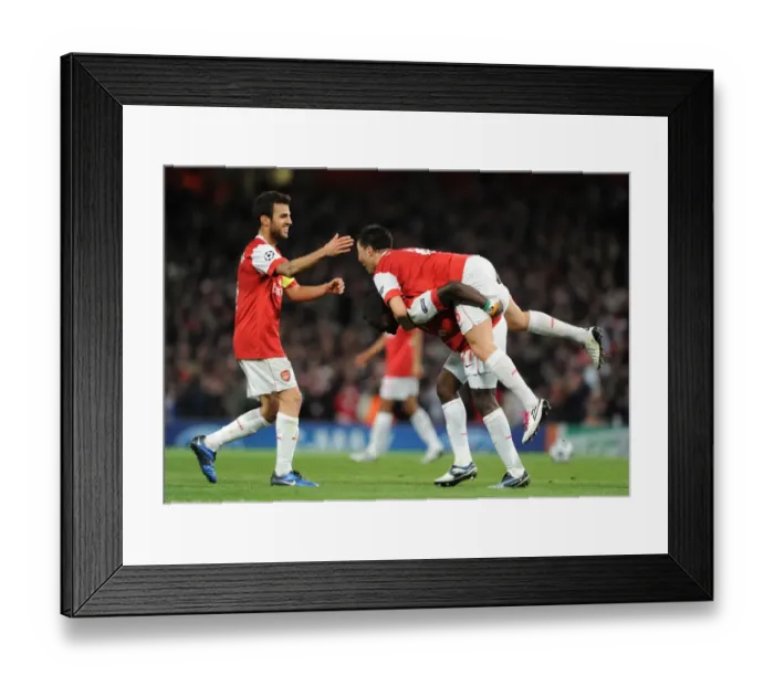 Framed Print : Arsenal Triumph: Nasri, Fabregas, and Eboue Celebrate Double Team Goal vs. Shakhtar Donetsk (5-1), UEFA Champions League, Emirates Stadium