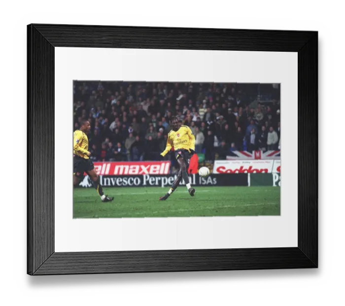 Framed Print : Emmanuel Adebayor shoots into an empty net to score the 3rd Arsenal goal