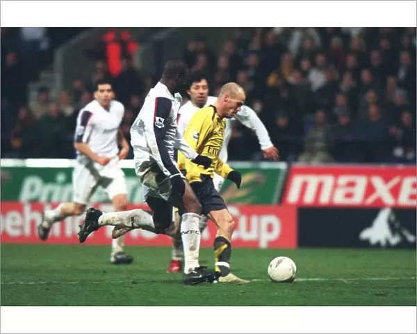 Freddie Ljungberg breaks past Bolton defender Abdoulaye Meite to score the 2nd Arsenal goal