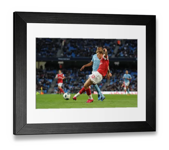 Framed Print : Nicklas Bendtner shoots past Man City goalkeeper Joe Hart to score the 3rd Arsenal goal