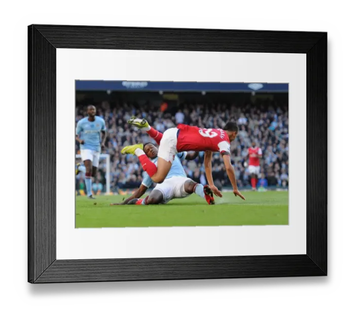 Framed Print : Marouane Chamakh is tripped by Man City defender Dedryck. Manchester City 0: 3 Arsenal Framed Print : Marouane Chamakh is tripped by Man City defender Dedryck. Manchester City 0: 3 Arsenal