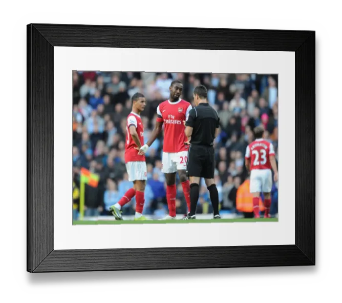 Framed Print : Johan Djourou (Arsenal) is booked by Mark Clattebnburg. Manchester City 0: 3 Arsenal