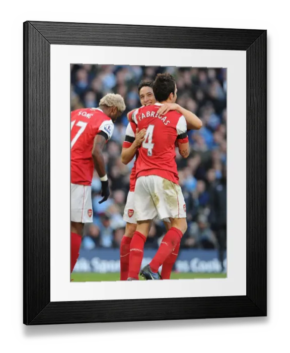 Framed Print : Sami Nasri and Cesc Fabregas celebrate the 2nd Arsenal goal, scored by Alex Song