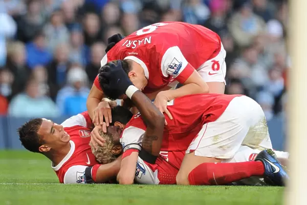 Alex Song celebrates scoring the 2nd Arsenal goal Marouane Chamakh, Sami Nasri