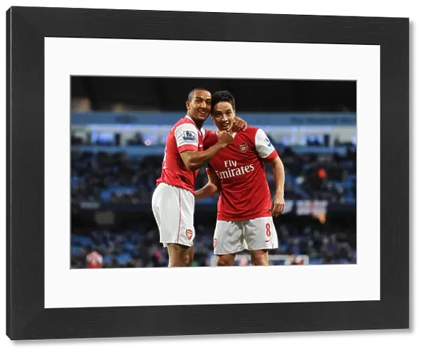 Theo Walcott and Samir Nasri celebrate the 3rd Arsenal goal, scored by Nicklas Bendtner