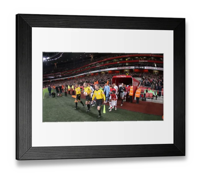 Framed Print : The match officials lead the team out onto the picth before the match. Arsenal 4