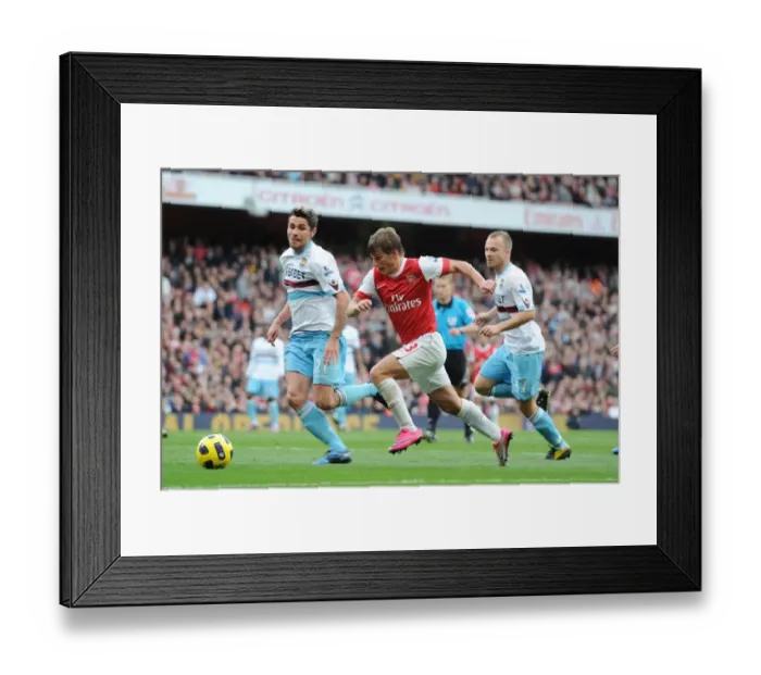 Framed Print : Andrey Arshavin (Arsenal) Valon Behrami (West Ham). Arsenal 1: 0 West Ham United