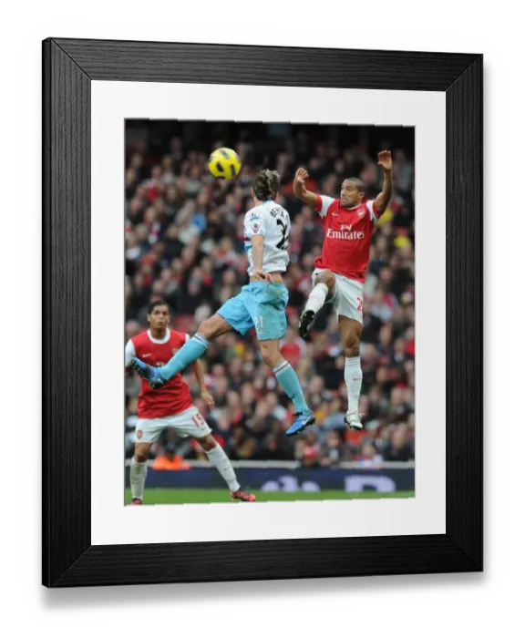 Framed Print : Clash at Emirates: Arsenal's Gael Clichy Shuts Down Valon Behrami's West Ham Framed Print : Clash at Emirates: Arsenal's Gael Clichy Shuts Down Valon Behrami's West Ham