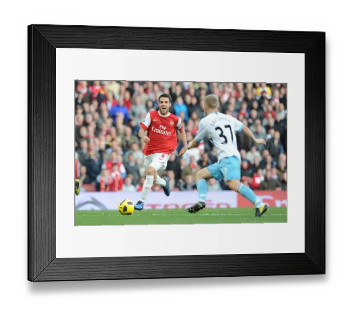 Framed Print : Cesc Fabregas (Arsenal) Lars Jacobsen (West Ham). Arsenal 1: 0 West Ham United
