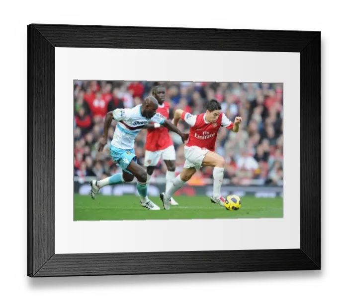 Framed Print : Samir Nasri (Arsenal) Herita Ilunga (West Ham). Arsenal 1: 0 West Ham United Framed Print : Samir Nasri (Arsenal) Herita Ilunga (West Ham). Arsenal 1: 0 West Ham United