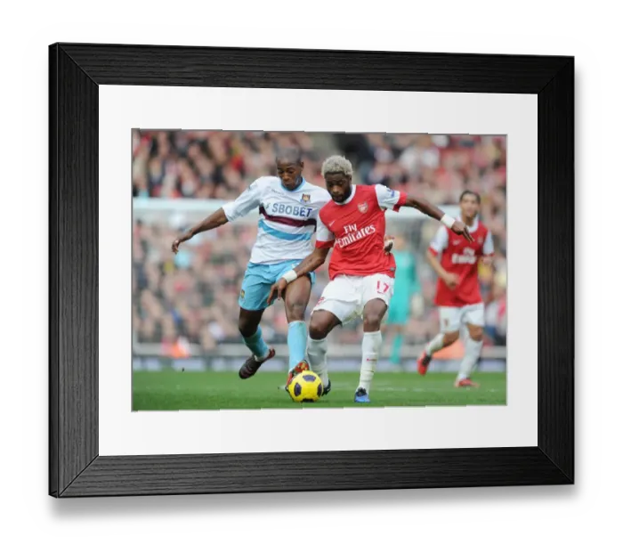 Framed Print : Alex Song (Arsenal) Luis Boa Morte (West Ham). Arsenal 1: 0 West Ham United Framed Print : Alex Song (Arsenal) Luis Boa Morte (West Ham). Arsenal 1: 0 West Ham United