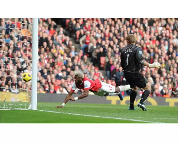 Alex Song heads past West Ham goalkeeper Rob Green to score the Arsenal goal