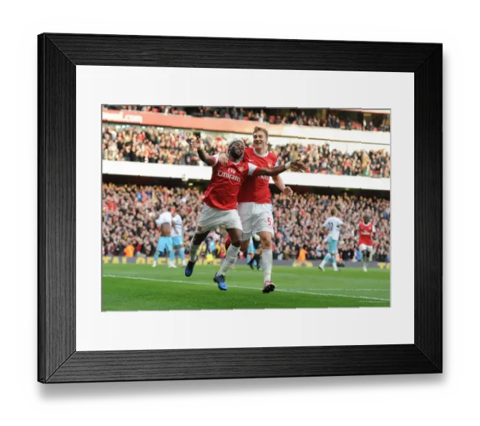 Framed Print : Arsenal's Unstoppable Duo: Alex Song and Nicklas Bendtner Celebrate 1-0 Victory Over West Ham United