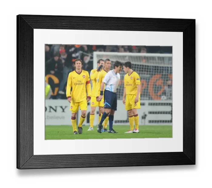 Framed Print : Samir Nasri (Arsenal) clashes with referee Massimo Busacca. Shakhtar Donetsk 2: 1 Arsenal Framed Print : Samir Nasri (Arsenal) clashes with referee Massimo Busacca. Shakhtar Donetsk 2: 1 Arsenal