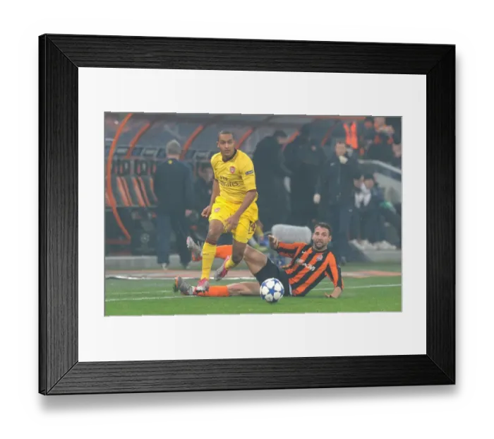 Framed Print : Theo Walcott vs. Razvan Rat: Arsenal's Close Call Against Shakhtar Donetsk in the UEFA Champions League (3 / 11 / 2010)