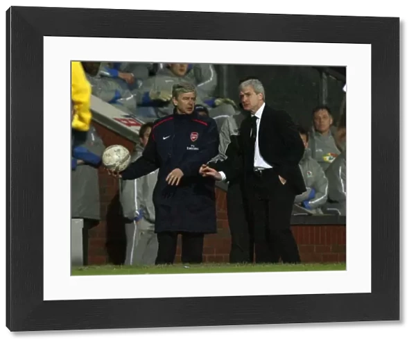 Arsenal manager Arsene Wenger with Blackburn Rovers manager Mark Hughes