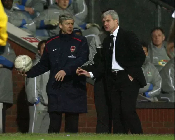 Arsenal manager Arsene Wenger with Blackburn Rovers manager Mark Hughes