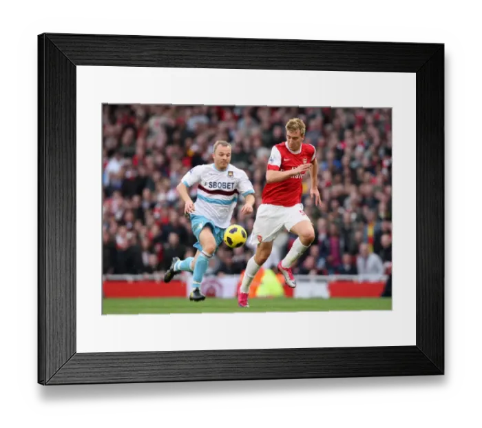 Framed Print : Nicklas Bendtner (Arsenal) Lars Jacobsen (West Ham). Arsenal 1: 0 West Ham United