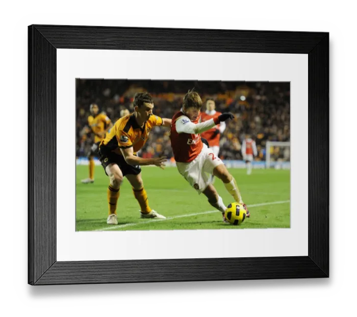 Framed Print : Andrey Arshavin (Arsenal) Kevin Foley (Wolves). Wolverhampton Wanderers 0: 2 Arsenal Framed Print : Andrey Arshavin (Arsenal) Kevin Foley (Wolves). Wolverhampton Wanderers 0: 2 Arsenal