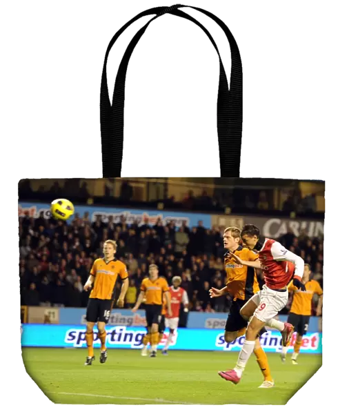 Marouane Chamakh heads past Wolves goalkeeper Marcus Hahnemann to score the 1st Arsenal goal