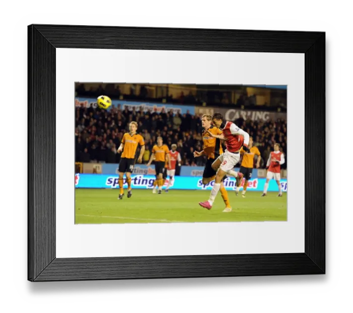 Framed Print : Marouane Chamakh heads past Wolves goalkeeper Marcus Hahnemann to score the 1st Arsenal goal