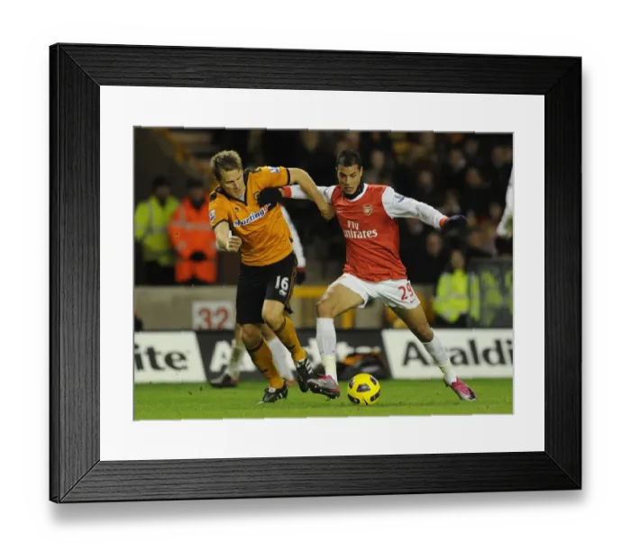 Framed Print : Marouane Chamakh (Arsenal) Christophe Berra (Wolves). Wolverhampton Wanderers 0: 2 Arsenal