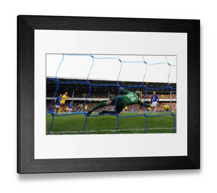 Framed Print : Cesc Fabregas shoots past Everton goalkeeper Tim Howard to score the 2nd Arsenal goal