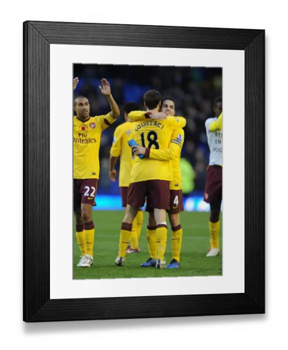 Framed Print : Arsenal captain Cesc Fabregas celebrates after the match with Sebastien Squillaci