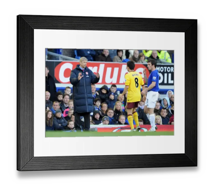 Framed Print : Arsenal manager Arsene Wenger talks with Samir Nasri during the match. Everton 1 Framed Print : Arsenal manager Arsene Wenger talks with Samir Nasri during the match. Everton 1