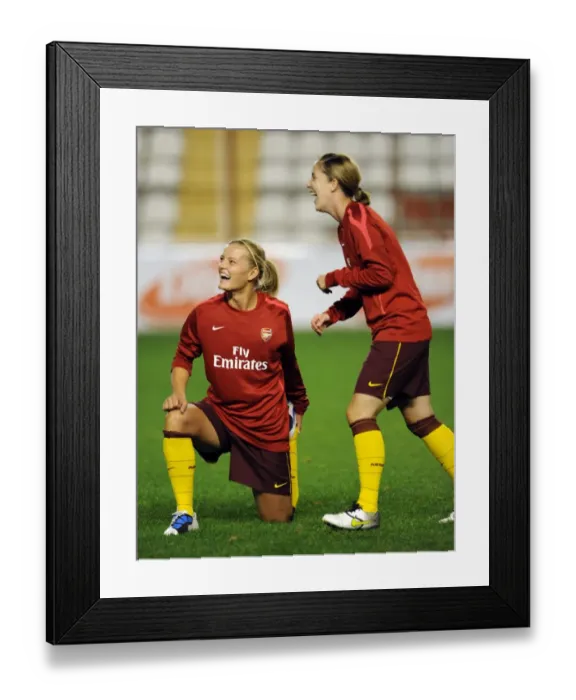 Framed Print : Katie Chapman and Yvonne Tracy (Arsenal) share a joke before the warm up