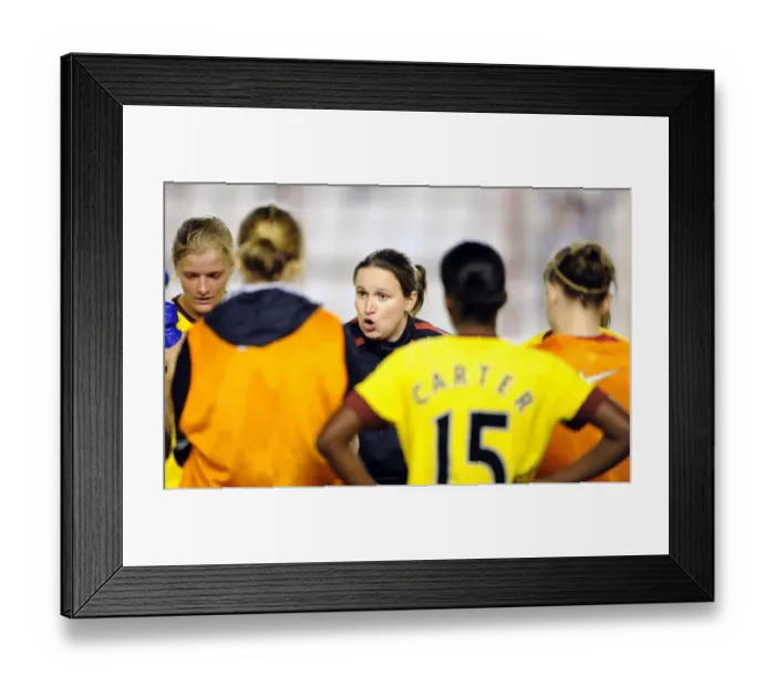 Framed Print : Laura Harvey the Arsenal Ladies Manager holds post match debreif on the pitch