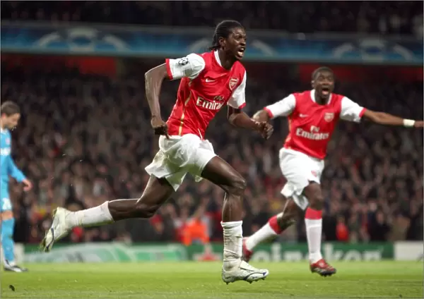 Emmanuel Adebayor (Arsenal) celebrates the own goal scored by Alex (PSV, not pictured)