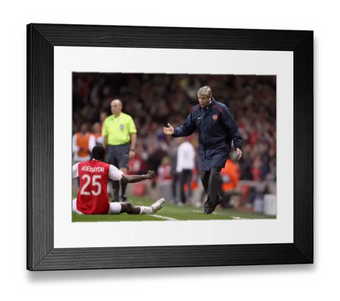 Framed Print : Arsene Wenger the Arsenal manager celebrates Arsenals goal with Emmanuel Adebayor