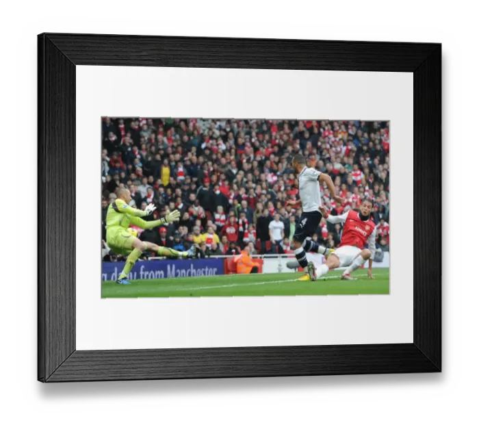 Framed Print : Marouane Chamakh scores Arsenals 2nd goal under pressure from Younes Kaboul Framed Print : Marouane Chamakh scores Arsenals 2nd goal under pressure from Younes Kaboul