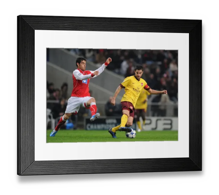 Framed Print : Cesc Fabregas vs Miguel Garcia: Arsenal's 2-0 Victory over SC Braga in UEFA Champions League Group H