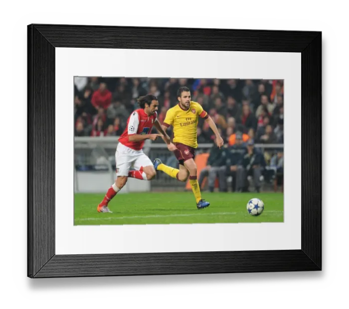 Framed Print : Cesc Fabregas (Arsenal) Miguel Garcia (Braga). SC Braga 2: 0 Arsenal, UEFA Champions League Framed Print : Cesc Fabregas (Arsenal) Miguel Garcia (Braga). SC Braga 2: 0 Arsenal, UEFA Champions League