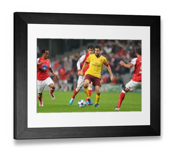 Framed Print : Cesc Fabregas (Arsenal) Leandro Salino (Braga). SC Braga 2: 0 Arsenal, UEFA Champions League