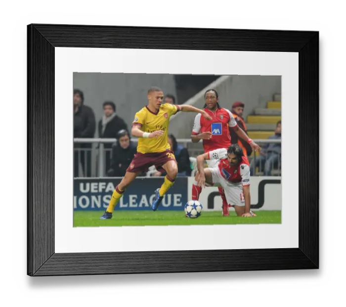 Framed Print : Gibbs vs. Garcia: Arsenal's Defensive Battle in SC Braga's 2-0 UEFA Champions League Victory
