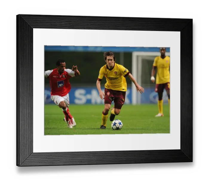 Framed Print : Tomas Rosicky (Arsenal) Leandro Salino (Braga). SC Braga 2: 0 Arsenal, UEFA Champions League