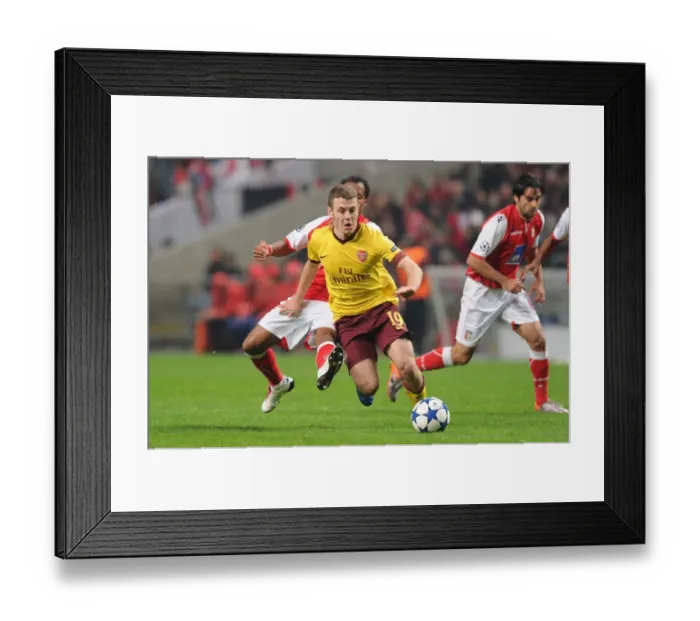 Framed Print : Jack Wilshere vs. Leandro Salino: Arsenal's Struggle Against Braga in UEFA Champions League