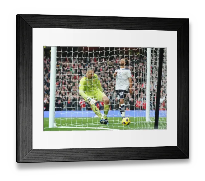 Framed Print : Beniot Assou-Ekotto (Tottenham) is dejected as Heurelho Gomes picks the ball out of the net following Samir Nasris strike for the 1st Arsenal goal. Arsenal 2: 3 Tottenham Hotspur. Baclays Premier League. Emirates Stadium, 20  /  11  /  10. Credit : Arsenal Football Club  / 