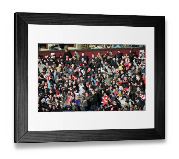 Framed Print : Arsenal fans celebrate the 2nd goal. Aston Villa 2: 4 Arsenal. Barclays Premier League Framed Print : Arsenal fans celebrate the 2nd goal. Aston Villa 2: 4 Arsenal. Barclays Premier League