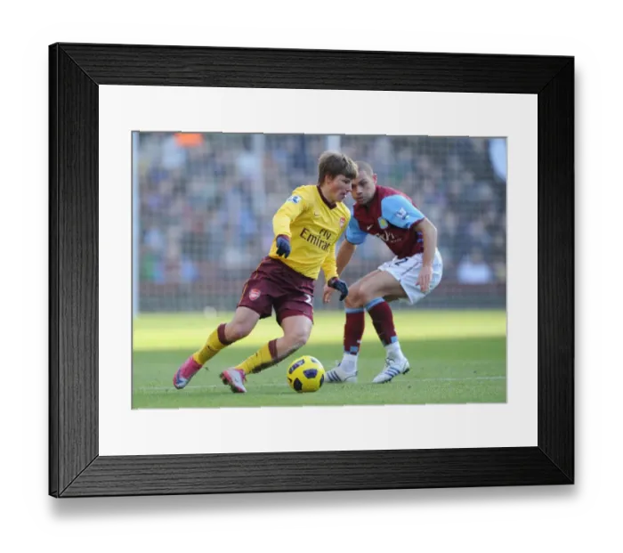 Framed Print : Andrey Arshavin (Arsenal) Luke Young (Villa). Aston Villa 2: 4 Arsenal. Barclays Premier League