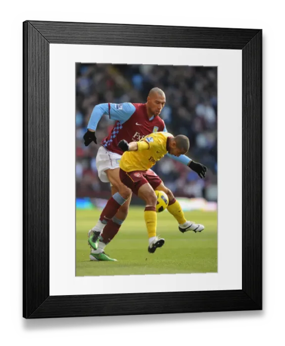Framed Print : Gael Clichy (Arsenal) John Carew (Villa). Aston Villa 2: 4 Arsenal. Barclays Premier League