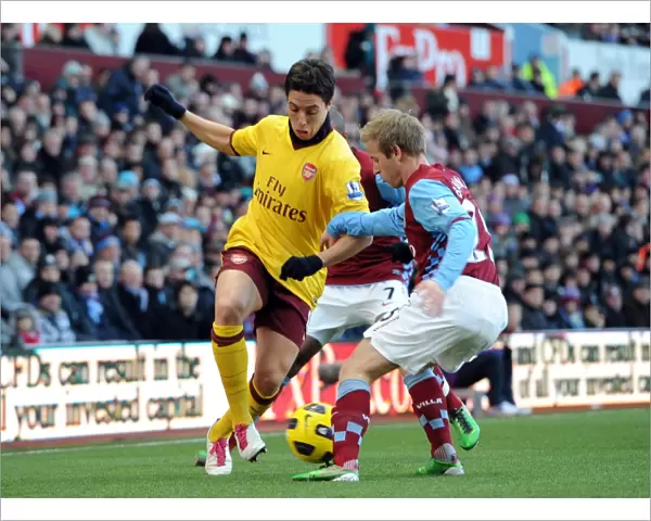 Samir Nasri (Arsenal) nutmegs Barry Bannan (Villa). Aston Villa 2: 4 Arsenal