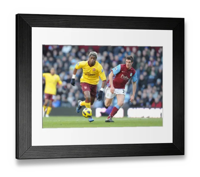 Framed Print : Alex Song (Arsenal) Ciaran Clark (Villa). Aston Villa 2: 4 Arsenal. Barclays Premier League