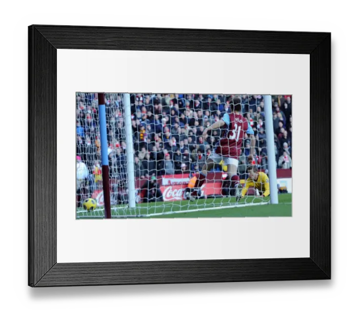 Framed Print : Jack Wilshere scores Arsenals 4th goal. Aston Villa 2: 4 Arsenal. Barclays Premier League